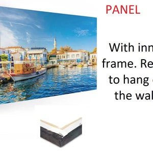 May include: A canvas print of a colorful cityscape with a boat in the foreground. The print is framed and ready to hang on the wall.  PANEL