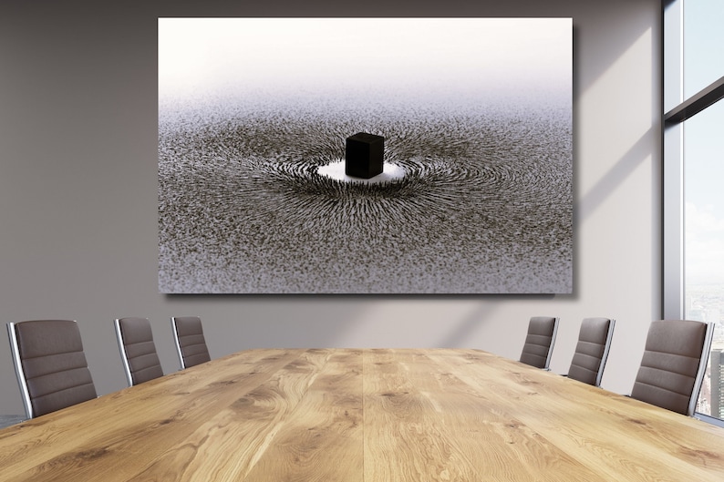 May include: A black and white abstract art print depicting a large crowd of people surrounding a black cube in the center of the image. The crowd is arranged in a circular pattern, creating a sense of movement and energy.