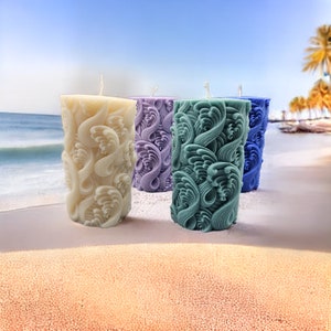 Give plain pillar candles a beachy look with sand and seashells