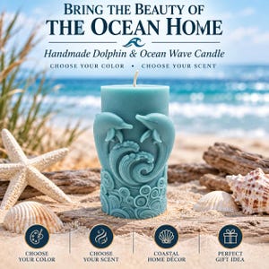May include: A cylindrical teal candle featuring a relief design of two dolphins leaping over stylised ocean waves. The text BRING THE BEAUTY OF THE OCEAN HOME and Handmade Dolphin & Ocean Wave Candle is printed above the candle.