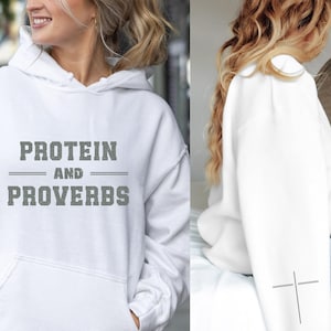 May include: White hooded sweatshirt with the text "PROTEIN AND PROVERBS" printed in grey on the front.