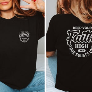 May include: Black t-shirt with a white graphic on the front that says "Keep Your Faith High and Your Squats Low". The same graphic is on the back of the shirt, but it is larger.