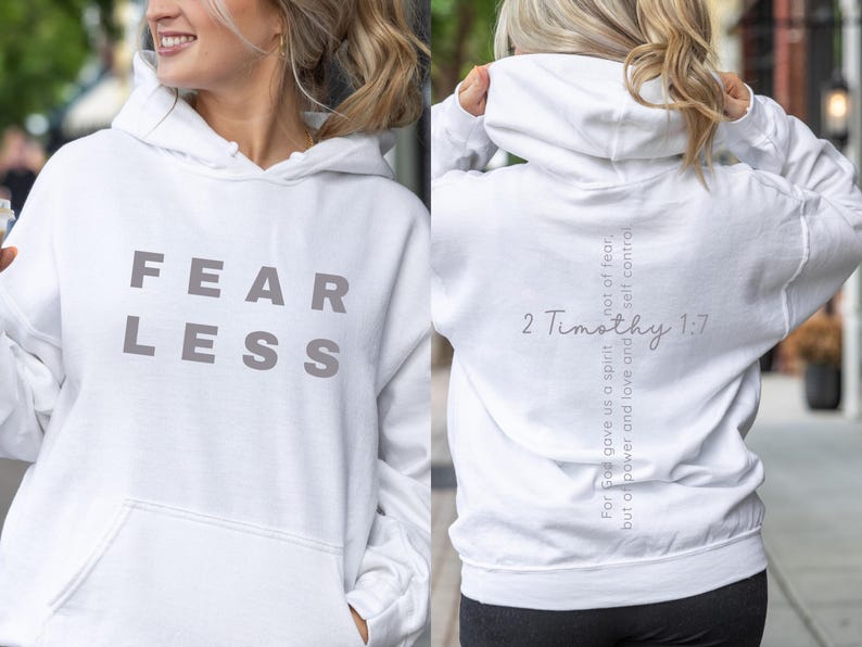 May include: White hoodie with the word "FEARLESS" printed on the front in grey lettering. The back of the hoodie has the text "For God gave us a spirit not of fear, but of power and love and self-control. 2 Timothy 1:7" printed in grey lettering.