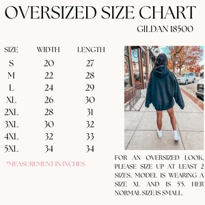 May include: Size chart for Gildan 18500 oversized sweatshirts, showing width and length measurements in inches for sizes S through 5XL. The chart includes a note that for an oversized look, please size up at least two sizes. A model is wearing a size XL and is 5'5" tall. Her normal size is small.