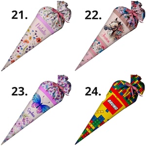 May include: Four conical gift bags labeled 21 through 24. Number 21 features wildflowers and the name Natalie. Number 22 shows a horse and flowers with the name Jessica. Number 23 displays a blue butterfly and the name Sophia. Number 24 has a colorful building block pattern and the name Bruno.