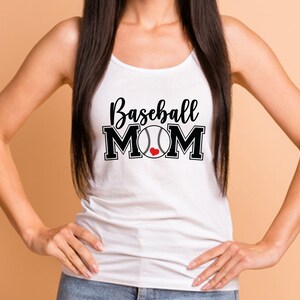May include: White tank top with the words "Baseball MOM" in black script and block letters. A baseball graphic with a red heart replaces the "O" in MOM. The top is a casual style.