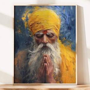 Könnte beinhalten: Gerahmtes Gemälde eines Mannes mit langem weißem Bart und gelbem Turban, die Hände zum Gebet gefaltet. Das Kunstwerk verwendet eine blaue und gelbe Farbpalette mit sichtbaren Pinselstrichen, die einen strukturierten Effekt erzeugen. Der Mann hat ein rotes Zeichen auf der Stirn.