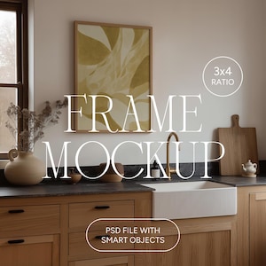 May include: A kitchen mockup featuring a framed abstract art print in a light wood frame. The kitchen has light wood cabinets, a white farmhouse sink, and a gold faucet. The image includes the text "FRAME MOCKUP" and "PSD FILE WITH SMART OBJECTS".