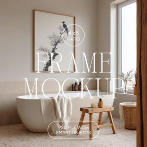 May include: A bathroom scene featuring a large framed artwork with a bird and floral design. The artwork is above a white bathtub with a towel. A wooden stool, bottles, and a woven basket are also present. The text "FRAME MOCKUP" and "PSD FILE WITH SMART OBJECTS" are visible.