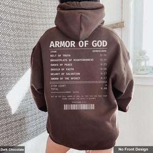 May include: A dark chocolate brown hoodie with a white print of a receipt listing the "Armor of God" with scripture references from Ephesians. The text reads "Put on the full armor of God, so that you can take your stand against the devil's schemes. Ephesians 6:11"