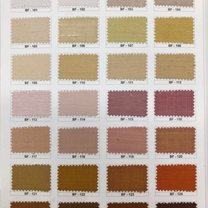 May include: Swatch card of 16 fabric samples in various shades of beige, brown, pink, and orange. The samples are labeled with numbers from BF-101 to BF-128. The card also includes the text "WIDTH 44" & 54".
