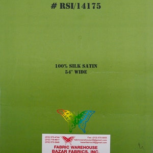 May include: Green card with white text that reads "Swiss Collection #RSI/14175 100% Silk Satin 54" Wide". Below the text is a colorful butterfly illustration. The card also includes contact information for Fabric Warehouse Bazar Fabrics, Inc. with phone numbers, fax number, and email addresses. The card also includes the company's address and business hours.