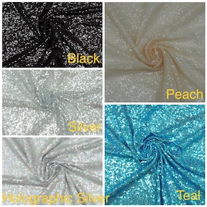 May include: Four swatches of sequined fabric in different colours: black, peach, silver, and teal. The fabric is textured and has a subtle shimmer.