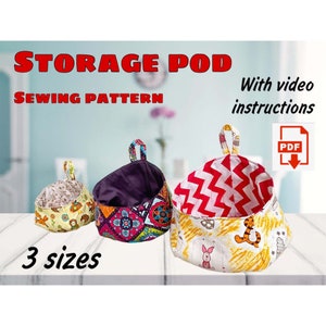 May include: Sewing pattern for a storage pod with three different sizes. The pattern includes video instructions and is available as a PDF download. The image shows three storage pods in different colours and patterns.
