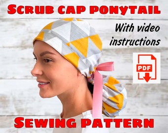 May include: A sewing pattern for a scrub cap with a ponytail opening. The cap is made of a yellow and gray fabric with a geometric pattern. The pattern includes instructions and a video tutorial.  PDF download.