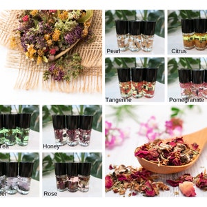 May include: A set of ten 10 ml glass roller bottles with different colored liquids and dried flowers inside. The bottles are labeled with the names of the scents: Pearl, Citrus, Tangerine, Pomegranate, Green Tea, Honey, Lavender, Rose.