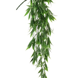 May include: A long, green, artificial hanging plant with leaves that cascade downwards. The plant is made of plastic and is designed to look like a real plant.