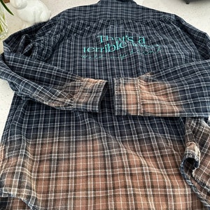 Upcycled button down shirt, “That’s a Terrible Idea” bleached