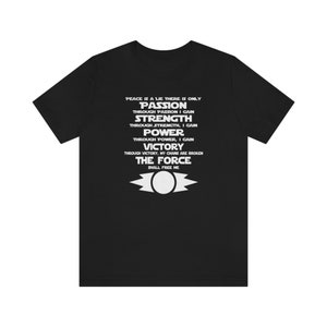 May include: Black t-shirt with white text that reads "Peace is a lie there is only Passion through passion I gain Strength through strength, I gain Power through power, I gain Victory through victory, my chains are broken The Force shall free me". The shirt also features a white symbol of a star with a circle in the center.