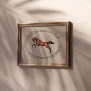 May include: A framed print of a brown horse with a black mane and tail, running in a circle. The horse is depicted in a vintage style, with a decorative border around the image.