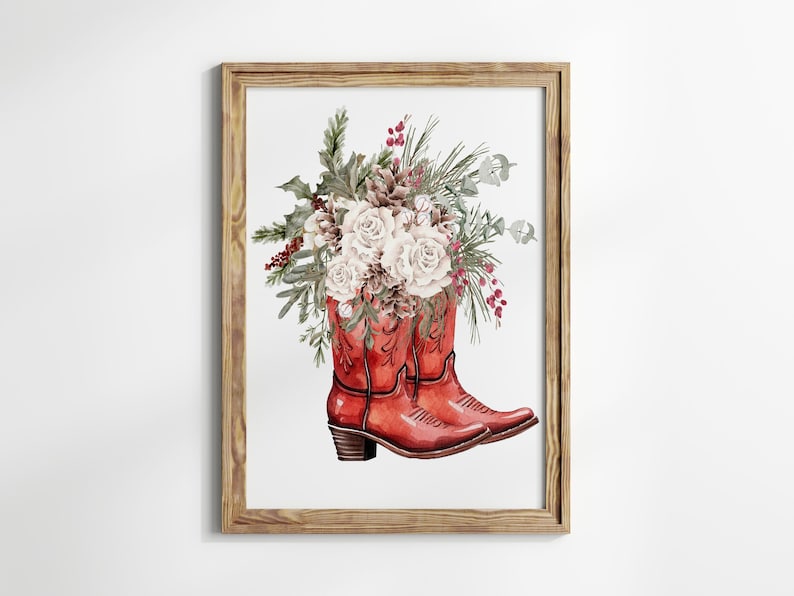 May include: A watercolor painting of a pair of red cowboy boots with a bouquet of white flowers and greenery inside. The boots are set against a white background.