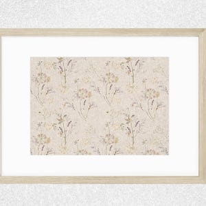 May include: A framed print with a beige background and a repeating pattern of delicate, dried flowers in shades of brown, purple, and white.