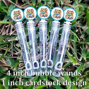 May include: Five clear plastic bubble wands with white internal wands and circular toppers. Each topper features a colorful Toy Story character graphic. The wands are arranged vertically, each measuring 4 inches in length with a 1 inch cardstock design.