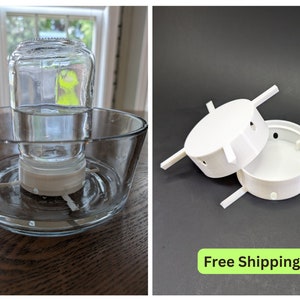 May include: A white 3D printed jar lid with four arms and holes. The lid is designed to fit on top of a glass jar and is used to create a hummingbird feeder. Free Shipping.
