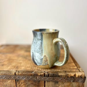 May include: A rustic wooden sign with the text "Welcome to our home" in a handwritten style. The sign features a distressed finish and a simple, inviting design, perfect for entryway decor.