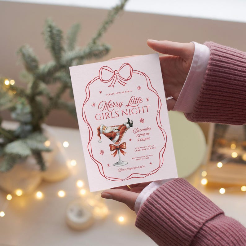 May include: A pink invitation card with a red border and a red bow at the top. The text on the card reads "Merry Little Girls Night" with a Santa Claus illustration in a martini glass. The date and time of the event are listed as "December 22nd at 7:00pm". The location is listed as "123 Molly Jolly Lane, North Pole".