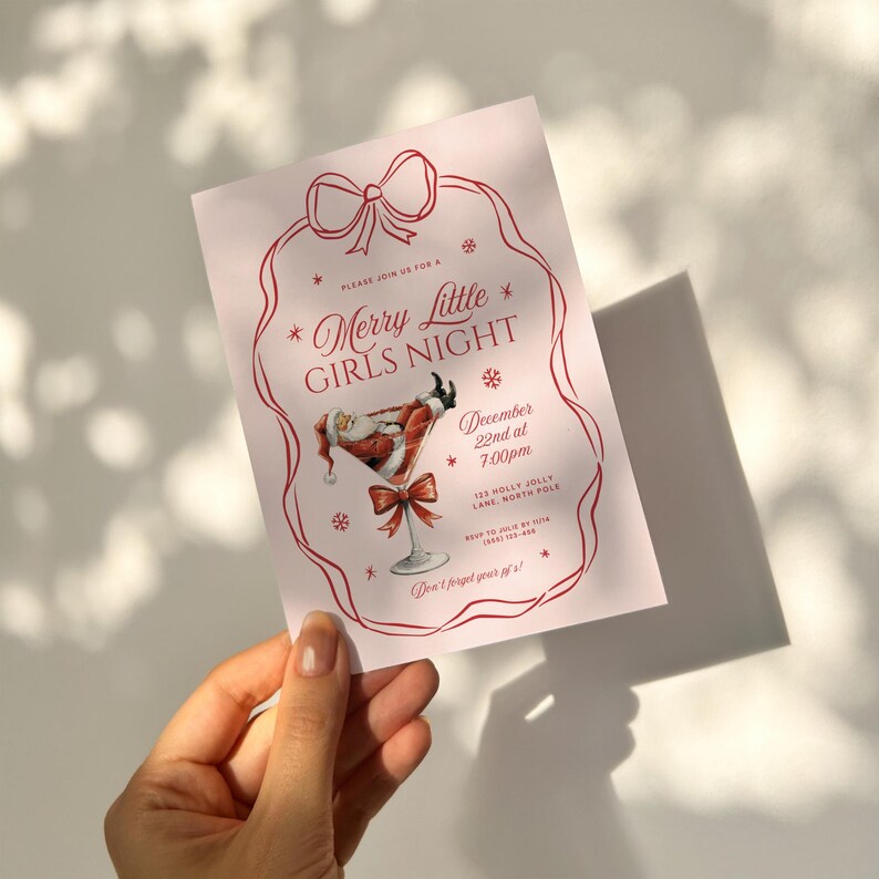 May include: A pink invitation card with a red border and a red bow at the top. The text on the card reads "Please join us for a *Merry Little* GIRLS NIGHT* December 22nd at 7:00pm 125 Molly Jolly Lane North Pole Don't forget your *" with a Santa Claus illustration in a martini glass.