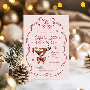 May include: Pink invitation card with a red border and a red bow at the top. The text reads "Please join us for a *Merry Little* GIRLS NIGHT" with a Santa Claus illustration in a martini glass. The date is December 22nd at 7:00pm. The address is 123 Holly Jolly Lane, North Pole. RSVP to Julie by 11/14 (555) 123-456. The text at the bottom reads "Don't forget your pj's!"