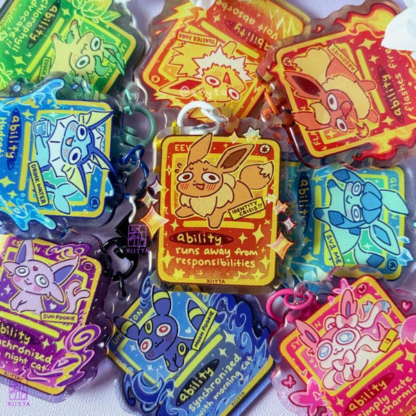 Eev-lutions Pocket Crisis Cards | Glitter Acrylic Keychains | PKMN TCG Elemental