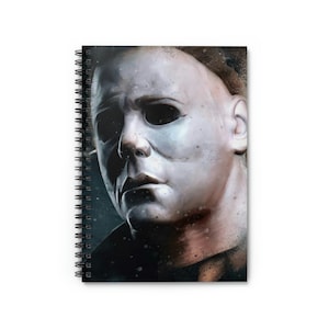 May include: A close-up of Michael Myers' mask from the Halloween franchise. The mask is white with black eye holes and a dark, textured background.