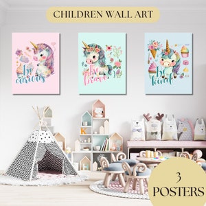 May include: Three colorful posters featuring a unicorn with a flower crown and the words "Be curious", "Be brave", and "Be kind".