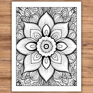 May include: Black and white floral mandala design on a white background. The intricate pattern features a central flower with detailed petals and surrounding ornamental elements. The artwork is suitable for coloring or decorative purposes.