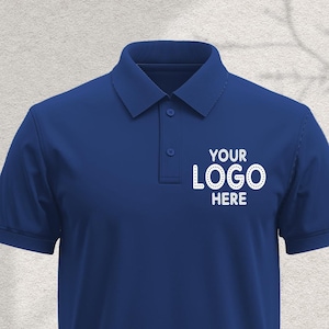 May include: A dark blue polo shirt with short sleeves and a white embroidered logo that says "YOUR LOGO HERE".