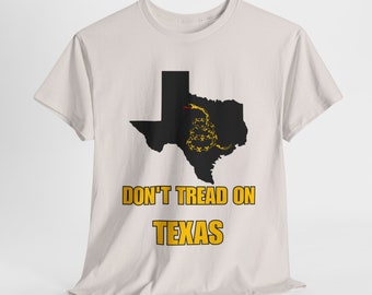 May include: A white t-shirt with a black outline of the state of Texas with a yellow rattlesnake inside. The text "Don't Tread on Texas" is printed in yellow below the state outline.