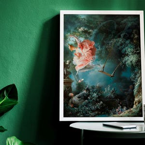 May include: A framed painting of a woman in a pink dress swinging on a rope swing in a lush green forest. The painting is set against a blue sky with white clouds.