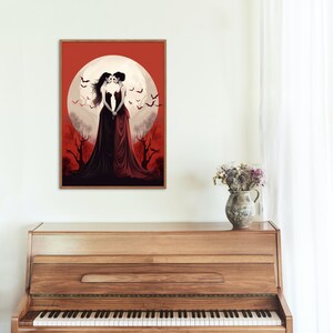 May include: Two women in long black and red dresses stand facing each other in front of a large, full moon. The moon is surrounded by a red sky and there are bats flying around it. The women are in a forest setting with trees behind them.