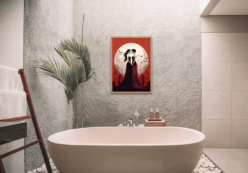 May include: A framed illustration of two women in long black dresses standing in front of a full moon with bats flying around them. The background is a red and orange gradient.