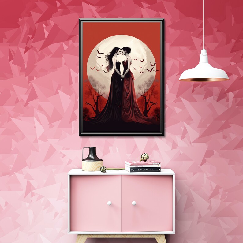 May include: A framed print of two women in black and red dresses standing in front of a full moon with bats flying around them. The background is a dark forest with trees and a red sky.