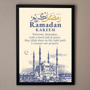 May include: A framed print with a vintage illustration of a mosque and the text "Ramadan Kareem" in Arabic and English. The text reads "Welcome, Ramadan, with a heart full of peace. May Allah show us the right path & answer our prayers."