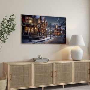 May include: A wooden cabinet with three doors and woven rattan panels. The cabinet is decorated with a framed print of a snowy village scene with a lamp on the top.