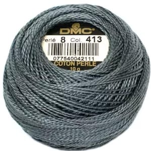 May include: A ball of gray DMC Perle cotton thread, Col. 413, with a label showing the brand, thread type, color number, and weight of 10 g. The thread is tightly wound, showing the texture of the cotton. Ideal for embroidery and other needlework projects.