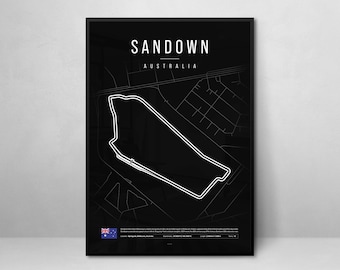 May include: Black and white minimalist print of the Sandown Raceway track in Australia. The track is outlined in white on a black background. The text "Sandown" and "Australia" is printed in white at the top of the print.
