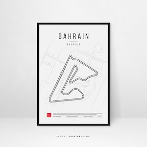 May include: A black and white line art print of the Bahrain International Circuit race track. The print features the name "Bahrain" and the flag of Bahrain. The print is framed in a black frame.