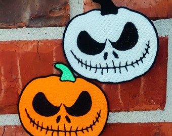 Calabaza de Jack Skellington de 3,17" x 3,00" que brilla en la oscuridad Pesadilla antes de Disneyland Disney Parks Resorts Parche bordado para planchar