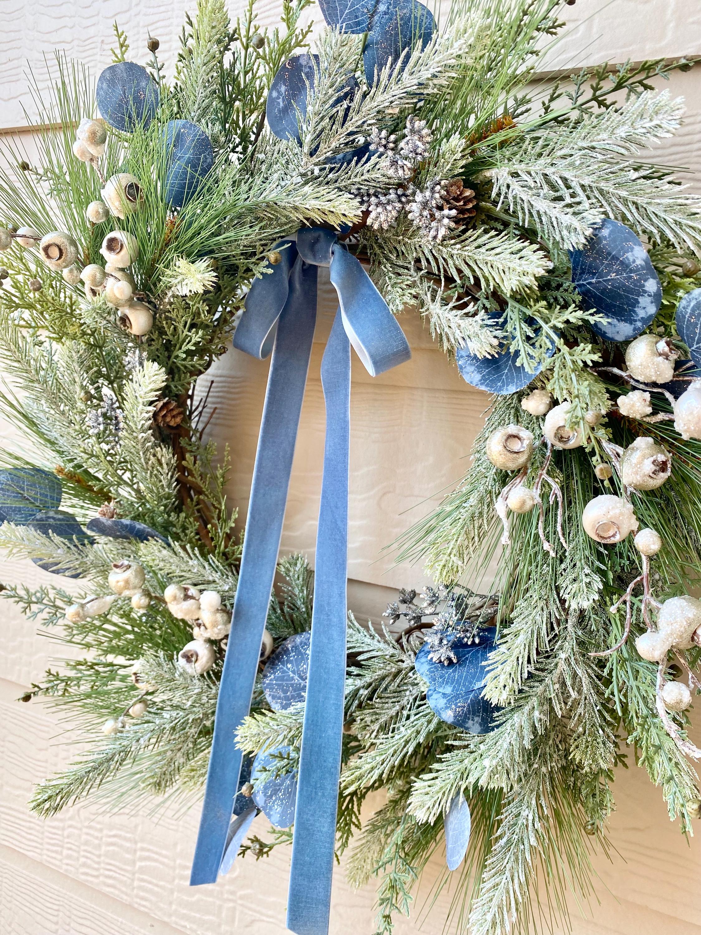 20” diameter Decorated  Wreath with blue shatterproof, white floral, berries
