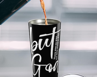 May include: Black stainless steel tumbler with a white inscription that reads "but GOD made a way."  There is coffee being poured into the tumbler.